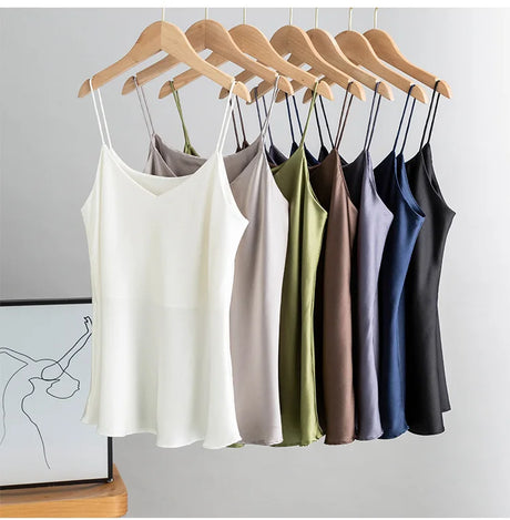 BandeauSilk™ double-layer silk camisoles in various colors hanging on wooden hangers, perfect for summer fashion.