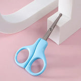 Light blue baby nail scissors designed for newborn care, ideal for trimming tiny nails safely.