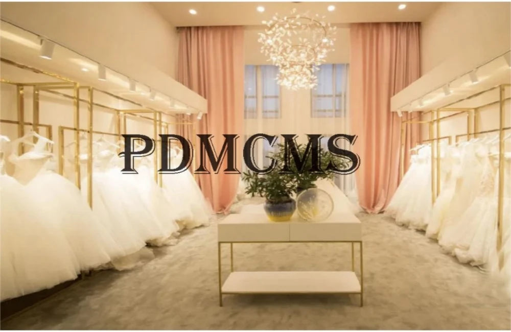Elegant bridal boutique interior showcasing multiple wedding dresses on display with soft lighting and pastel decor.