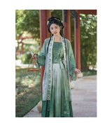 Women’s Hanfu cosplay in elegant green dress with traditional styling, showcasing Asian-inspired fashion.