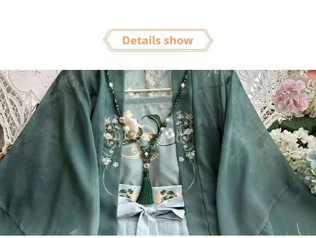 Detailed view of Song Dynasty Hanfu set featuring green chiffon fabric and floral embroidery.