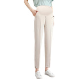 Stylish maternity pants in beige, featuring a comfortable waistband and pockets, ideal for summer work wear.