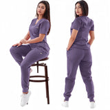 Women’s breathable purple medical scrub set featuring elastic short sleeves and comfortable pants.