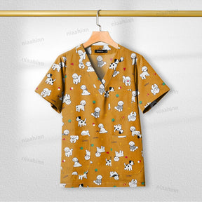 Short sleeve printed nursing scrub top with cute dog patterns, breathable cotton fabric, perfect for healthcare and pet grooming.