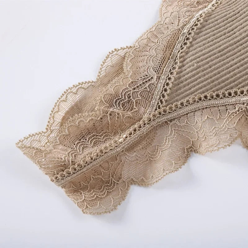 Close-up view of the intricate lace detailing on a WireFreeFlex™ seamless tank bra top in beige.
