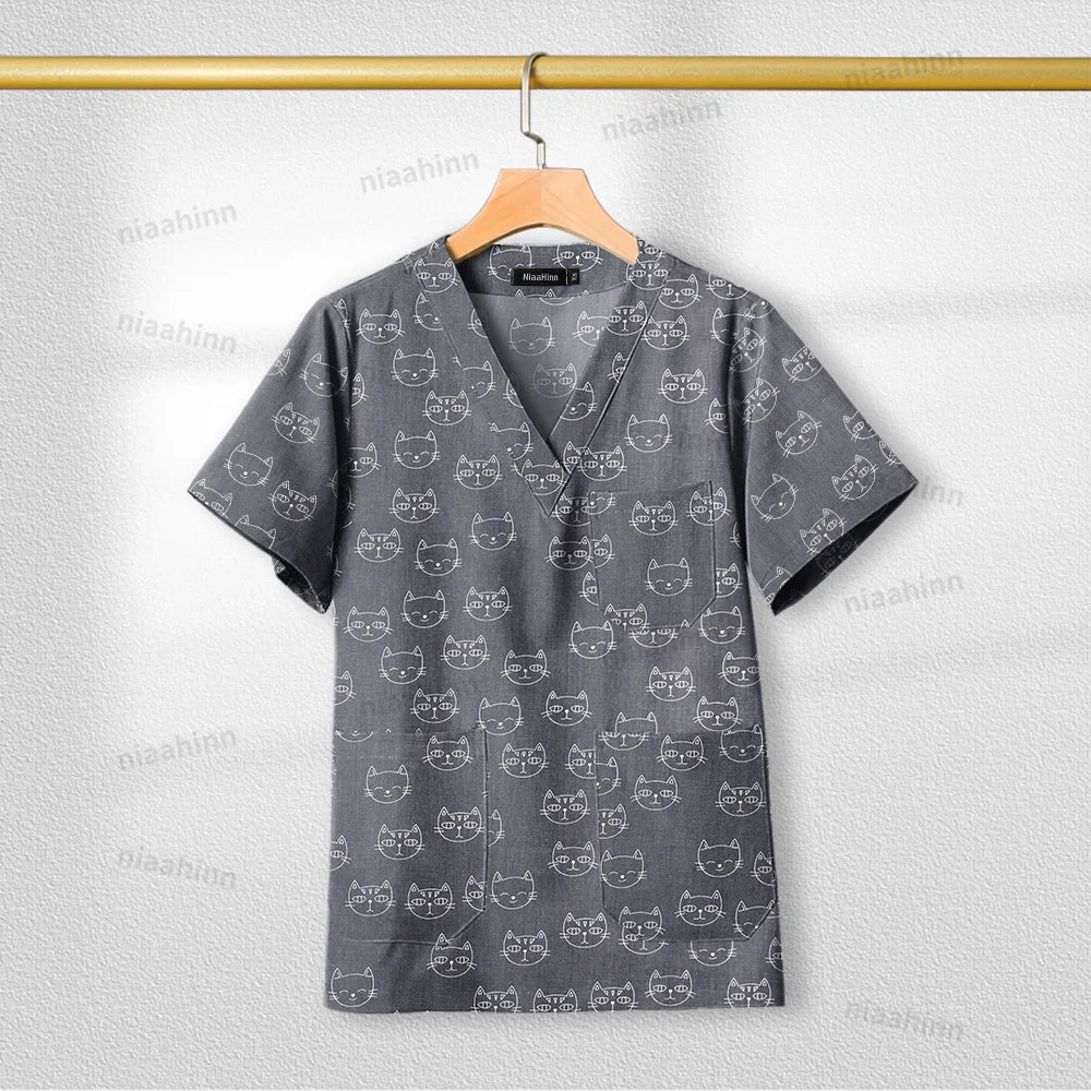 Printed nursing scrub top with cat pattern, short sleeve, V-neck, breathable cotton fabric for women healthcare professionals.