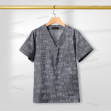 Printed nursing scrub top with cat pattern, short sleeve, V-neck, breathable cotton fabric for women healthcare professionals.