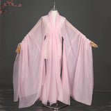 Women’s classical Hanfu stage costume in soft pink, featuring flowing sleeves and lightweight polyester fabric.