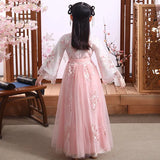Back view of a girl in a pink modern fairy Hanfu cosplay dress with floral embroidery.