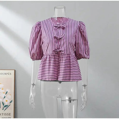 BowChic Stripe Lace-Up Blouse for women, featuring puff sleeves and a stylish striped design in pink.