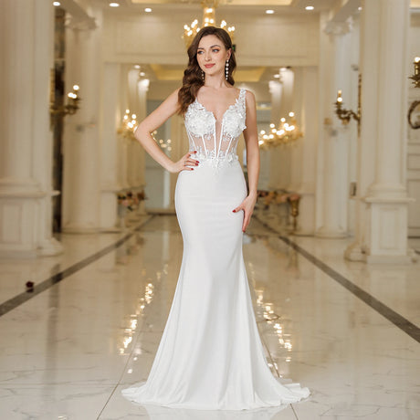 Model wearing a MisShow White Mermaid Wedding Dress with lace and pearl details in a luxurious venue.