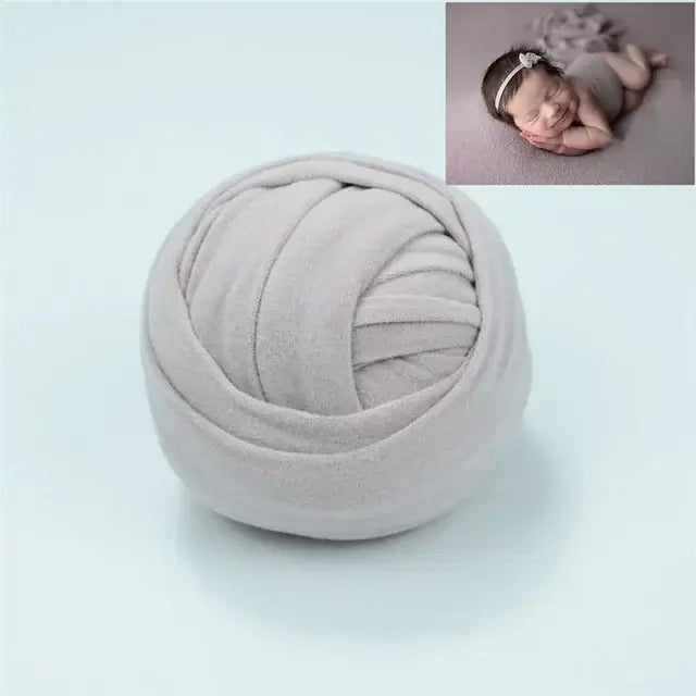 Soft gray polyester blanket ball, ideal for newborn photography backdrop and styling for baby photos.
