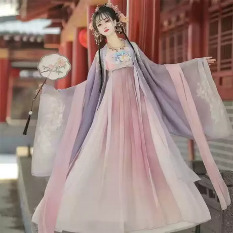 Elegant woman wearing a Hanfu traditional dress in pastel colors, perfect for parties and cultural events.