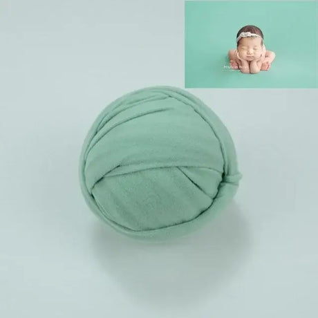 Solid mint green baby blanket backdrop for photo shoots, suitable for unisex infants aged 0-1 year.