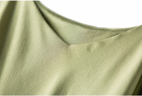 Close-up of the v-neck design of the BandeauSilk™ double-layer silk camisole in olive green.