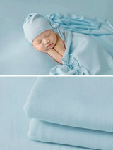 Newborn soft wrap blanket in light blue, perfect for photography and gentle comfort for babies.