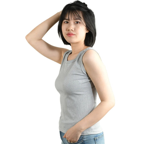 Woman wearing a SlipFit™ anti-slip cami, showcasing its slimming and lightweight design for summer comfort.