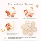 Step-by-step guide for using DLY handmade flower-shaped milestone stickers for babies.