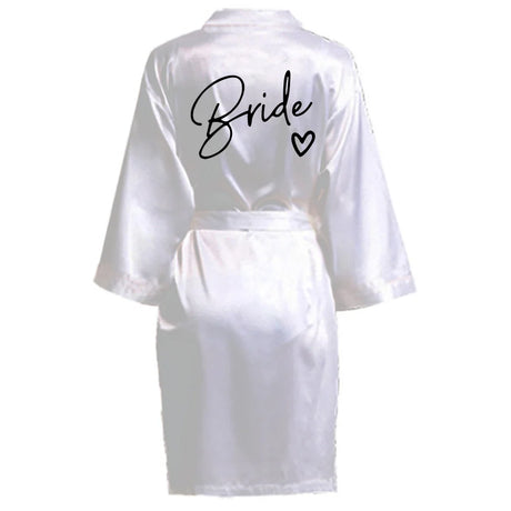 Elegant white satin robe with 'Bride' printed on the back, perfect for bridal parties and celebrations.