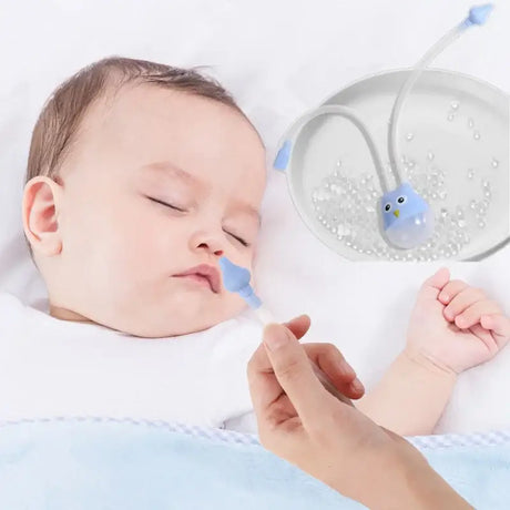 Baby sleeping while using a cartoon owl nasal aspirator, designed for gentle nasal relief.