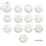 Set of 12 newborn milestone cards featuring greenery design for baby photography, celebrating special moments and events.