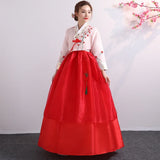 Korean Palace Hanbok in red with floral details, perfect traditional dress for women, showcasing cultural elegance and style.