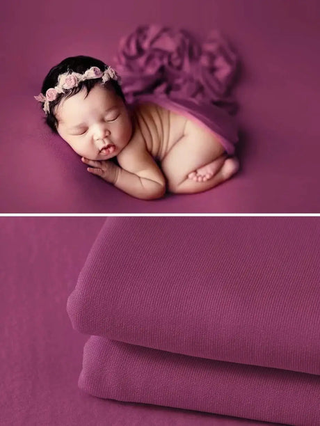 Newborn soft wrap blanket in purple displayed with a sleeping baby, perfect for photography and comfort.
