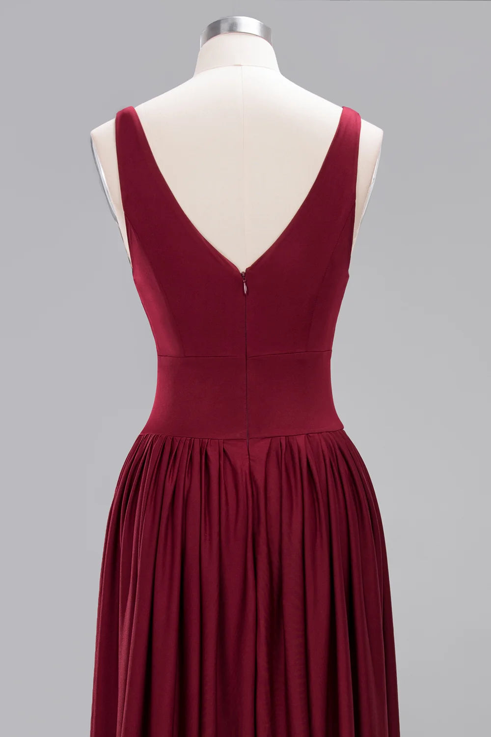 Back view of a sleeveless V-neck bridesmaid dress in deep burgundy, featuring pleats and a floor-length design.
