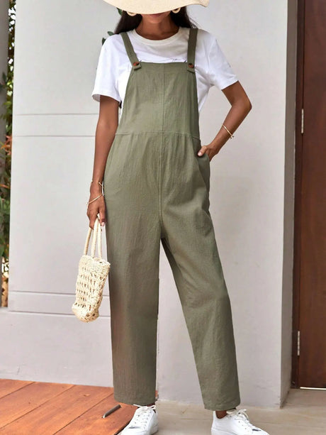 Stylish adjustable maternity overalls in olive green, paired with a white tee and a casual bag, perfect for comfort.