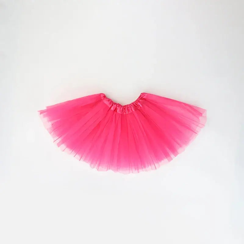 Bright pink tutu skirt for girls, ideal for dress-up and playful outfits, lightweight and fun for summer occasions.