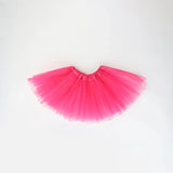 Bright pink tutu skirt for girls, ideal for dress-up and playful outfits, lightweight and fun for summer occasions.
