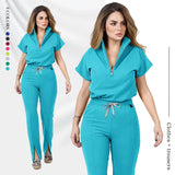 Women's medical scrub set featuring a zipper top and pants in vibrant teal, designed for comfort and style in various professional settings.
