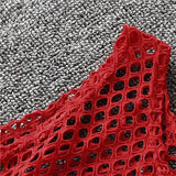 Close-up of the red fishnet material of a MeshGlow™ summer crop top, showcasing its breathable and hollow-out design.