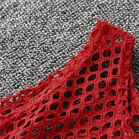 Close-up of the red fishnet material of a MeshGlow™ summer crop top, showcasing its breathable and hollow-out design.