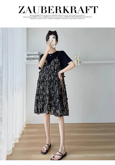 Elegant black floral dress with ruffles and short sleeves, perfect for casual summer outings.
