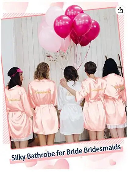 Silky bathrobe for brides and bridesmaids in pink with balloons in the background, perfect for wedding preparations.