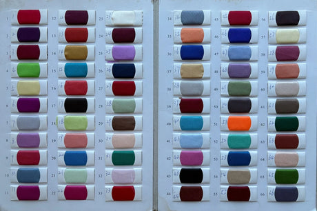 Color swatches of various fabrics showcasing a diverse palette for custom wedding dress designs.