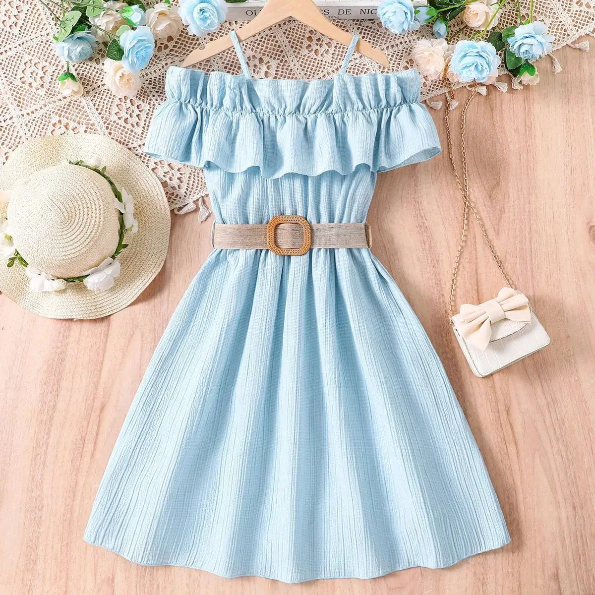 Light blue off-shoulder casual dress for girls with ruffled neckline and belted waist, perfect for summer.