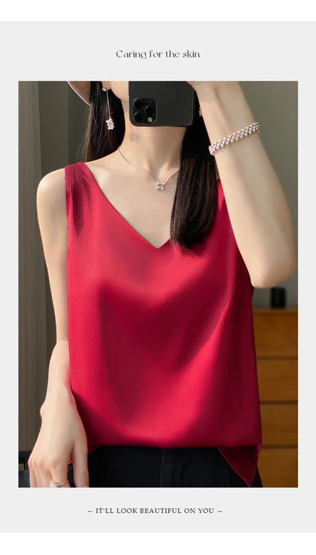 Woman wearing a red satin V-neck camisole, showcasing elegant summer style and comfort.