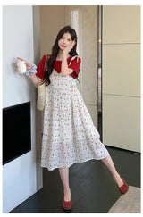 Model wearing a floral two-piece maternity skirt with contrasting colors in a modern indoor setting.