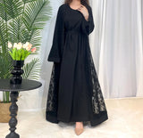 Elegant black Dubai Moroccan Kaftan with lace detailing, perfect for casual Islamic dress for all seasons.