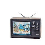 Vintage-style mini television showcasing a colorful animated scene with characters in action, perfect for decor or photography.