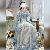 Vintage blue Hanfu cosplay dress 3-piece set worn by a model in a serene indoor setting with floral decor.