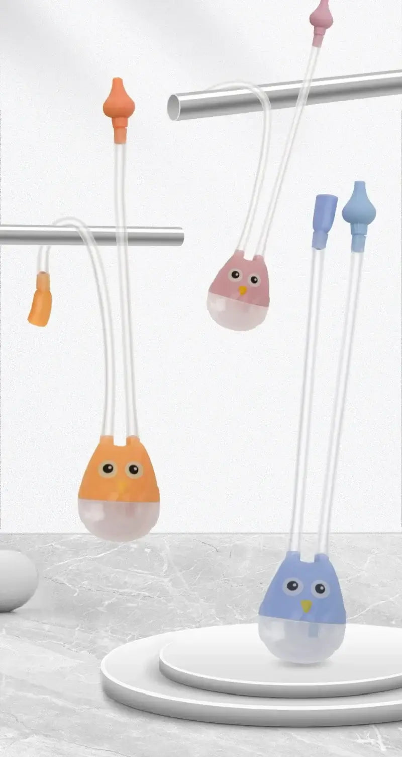 Colorful cartoon infant nasal aspirators displayed on a shelf, designed for safe and gentle suction for babies.