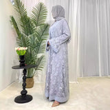 Elegant Dubai Moroccan Kaftan dress in light gray, suitable for all seasons and casual wear, modeled with a hijab.