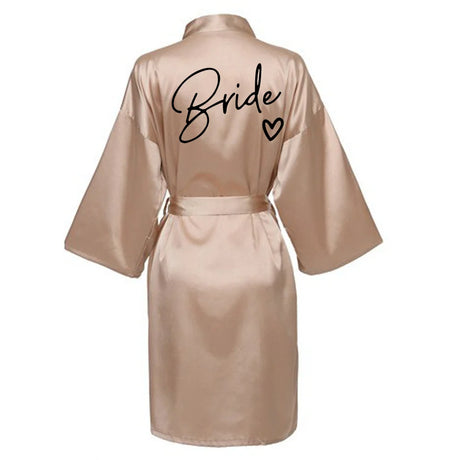 Bride satin robe with elegant lettering on the back, perfect for bridal parties and wedding preparations.