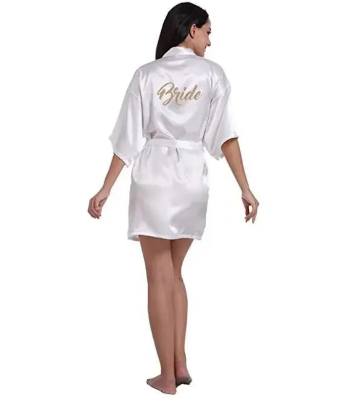Plus size silk bride robe in white satin, showcasing elegant back design with 'Bride' lettering, perfect for wedding attire.