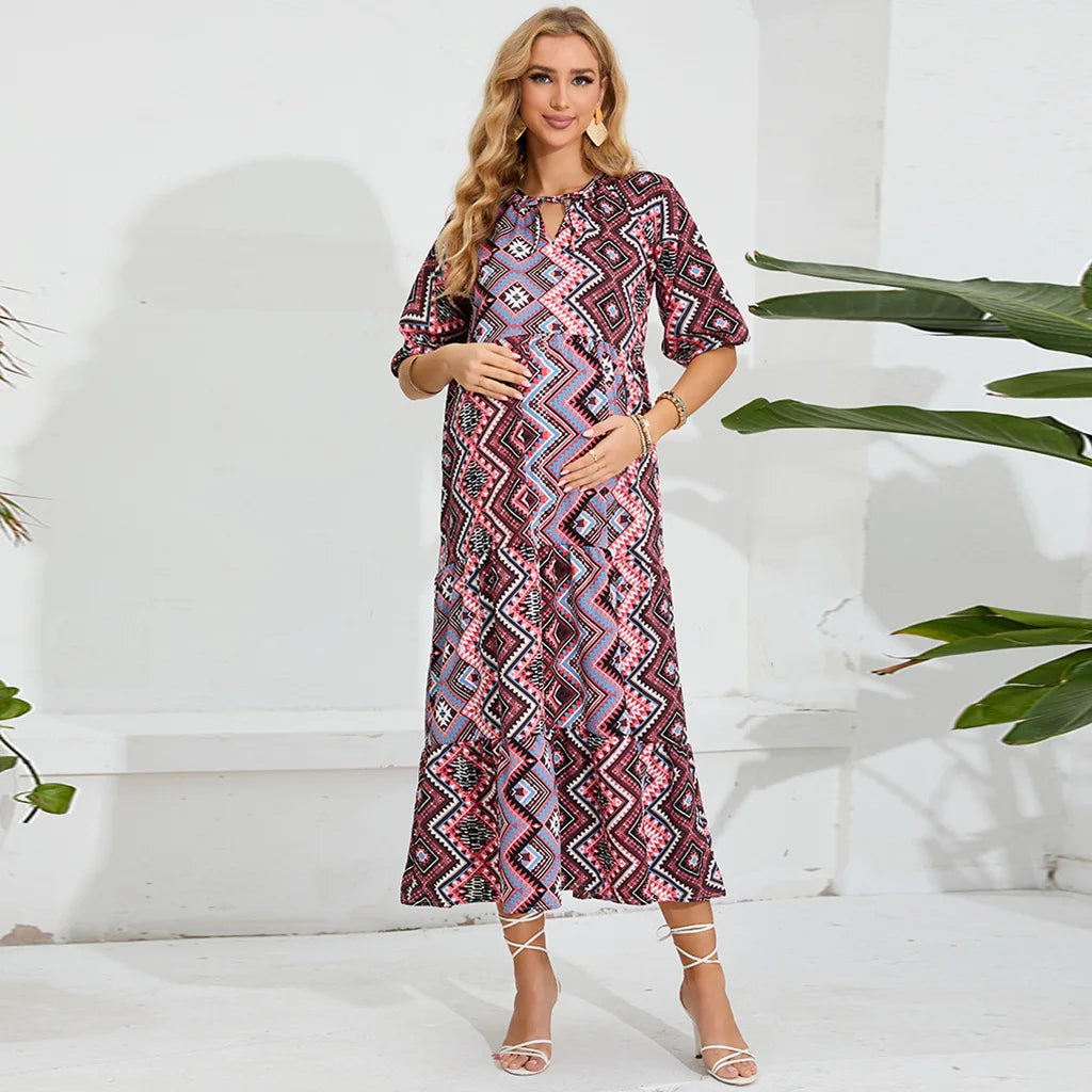 Elegant geometric patterned beach maternity dress for summer photoshoots, perfect for expecting mothers.