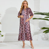 Elegant geometric patterned beach maternity dress for summer photoshoots, perfect for expecting mothers.