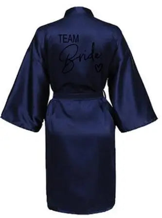 Back view of a navy satin Team Bride kimono robe for women, perfect for bridal parties and summer celebrations.
